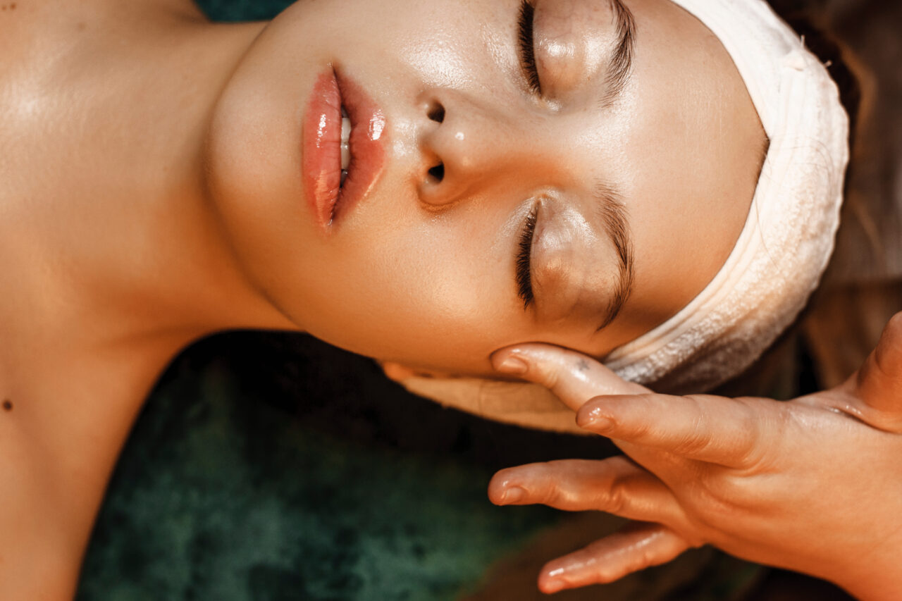 Close up of a beautiful woman doing facial procedures with hyalu